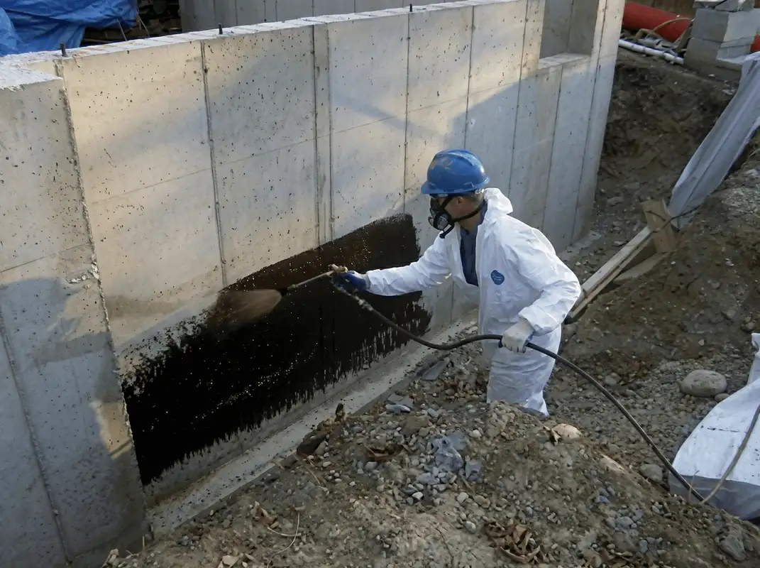Professional waterproofing the exterior walls of the basement in Worcester, MA