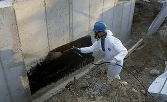 Professional waterproofing the exterior walls of the basement in Worcester, MA