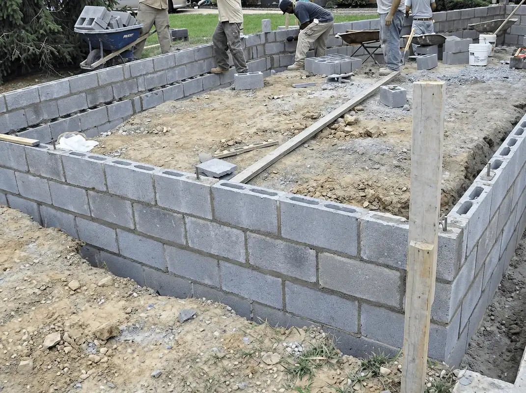 Professionals building a foundation with blocks in Worcester, MA