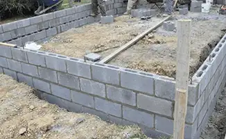 Professionals building a foundation with blocks in Worcester, MA