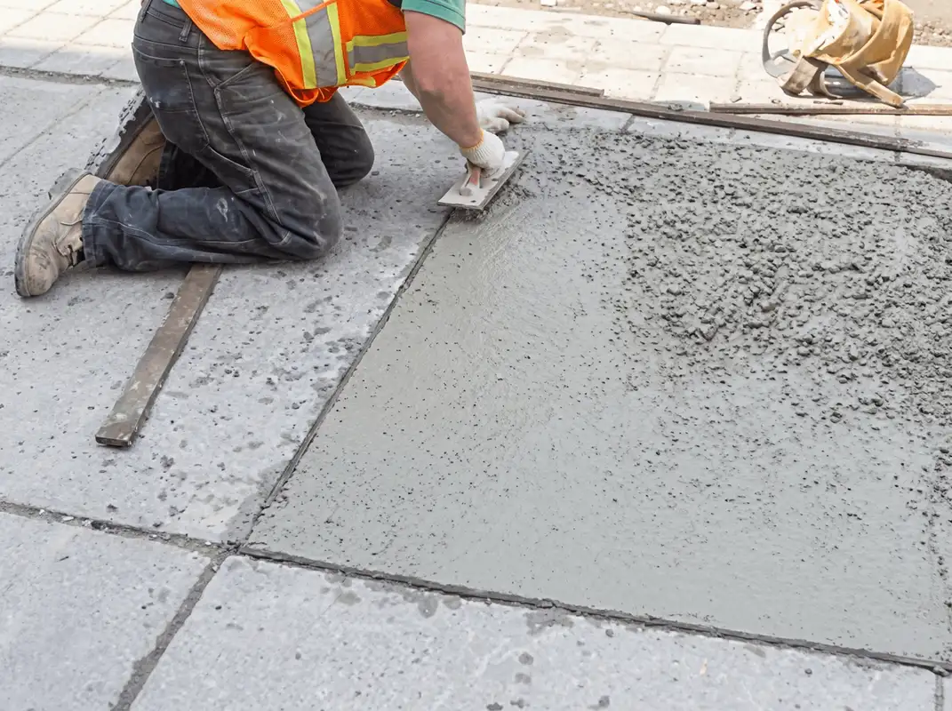 Professional repairing a concrete floor in Worcester, MA