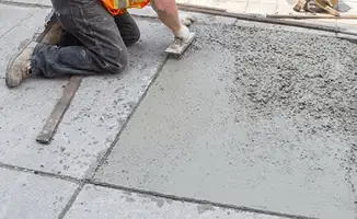 Professional repairing a concrete floor in Worcester, MA