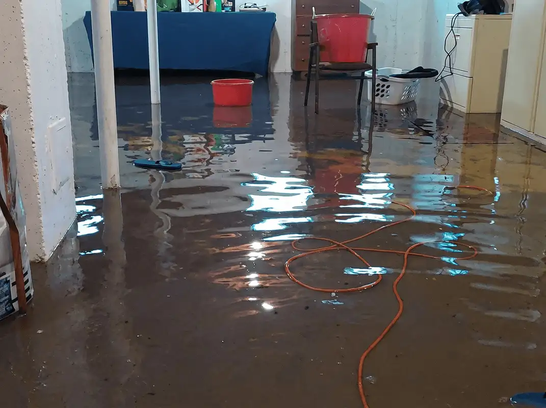 Basement with boiler, cabinets and washing machine completely flooded in Worcester, MA