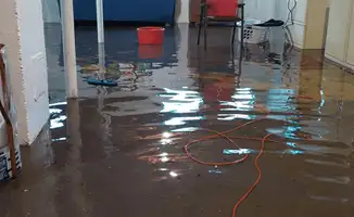 Basement with boiler, cabinets and washing machine completely flooded in Worcester, MA
