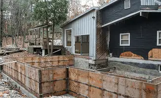 Prepared site with foundation forms for home remodeling and addition project in Worcester, MA